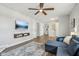 Spacious living room with sectional sofa and hardwood floors at 4155 Senour Rd, Indianapolis, IN 46239
