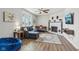 Cozy living room with sectional sofa, fireplace, and large TV at 4155 Senour Rd, Indianapolis, IN 46239