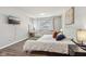 Spacious main bedroom with king-size bed and TV at 4155 Senour Rd, Indianapolis, IN 46239