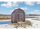 Rustic wooden shed in a snowy backyard at 4155 Senour Rd, Indianapolis, IN 46239