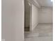 Spacious basement featuring light gray faux-wood plank flooring and storage space, ideal for customization at 5131 Nicodemus Dr, Plainfield, IN 46168