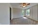 Spacious bedroom with carpeted floor, ceiling fan, and access to bathroom at 5131 Nicodemus Dr, Plainfield, IN 46168