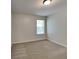 Simple bedroom with carpeted floor and window with blinds at 5131 Nicodemus Dr, Plainfield, IN 46168