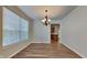 Spacious dining room with hardwood floors and chandelier at 5131 Nicodemus Dr, Plainfield, IN 46168