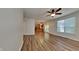 Open living room with hardwood floors and kitchen view at 5131 Nicodemus Dr, Plainfield, IN 46168
