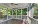 Relaxing screened porch with wooden deck and wooded views at 5131 Nicodemus Dr, Plainfield, IN 46168