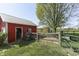 Red barn with a metal roof, adjacent to fenced pasture, and a view of the countryside at 5750 W 300 N Rd, Bargersville, IN 46106