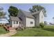 Exterior view with a deck and lush garden, offering an outdoor oasis for relaxation and entertainment at 5750 W 300 N Rd, Bargersville, IN 46106