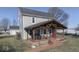 Two-story farmhouse with a large covered porch and landscaped yard at 5750 W 300 N Rd, Bargersville, IN 46106
