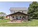 Charming two-story home with a covered front porch and mature trees offering a relaxing outdoor space at 5750 W 300 N Rd, Bargersville, IN 46106