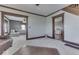 Open living space with multiple seating areas and hardwood floors at 5750 W 300 N Rd, Bargersville, IN 46106