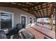 Spacious covered porch with brick flooring and outdoor seating at 5750 W 300 N Rd, Bargersville, IN 46106