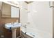Full bathroom with pedestal sink and shower/tub combo at 6847 W 15Th St, Indianapolis, IN 46214