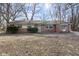 Brick ranch house with a large front yard at 6847 W 15Th St, Indianapolis, IN 46214