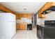 Kitchen with wood cabinets and appliances at 6847 W 15Th St, Indianapolis, IN 46214
