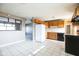 Kitchen with wood cabinets and tile floor at 6847 W 15Th St, Indianapolis, IN 46214