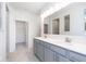 Elegant bathroom with double vanity, large mirror, and walk-in shower at 7300 Legends Way, Whitestown, IN 46052