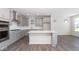 Modern kitchen with stainless steel appliances and island at 7300 Legends Way, Whitestown, IN 46052