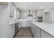 Modern kitchen featuring an island, stainless steel appliances, and sleek light gray cabinetry at 7300 Legends Way, Whitestown, IN 46052