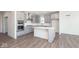Modern kitchen with gray cabinets, stainless steel appliances, and an island at 7300 Legends Way, Whitestown, IN 46052