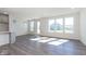 Bright living room with hardwood floors and large windows at 7300 Legends Way, Whitestown, IN 46052