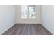 Bright office features gray vinyl flooring and large windows at 7300 Legends Way, Whitestown, IN 46052