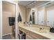 Classic bathroom with a large vanity and mirror at 741 Ironwood Dr, Avon, IN 46123