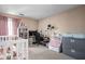 Versatile bedroom featuring a crib, workspace, and storage at 741 Ironwood Dr, Avon, IN 46123