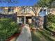Tan-colored townhouse exterior with a wooden fence and walkway at 741 Ironwood Dr, Avon, IN 46123