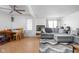 Open living room with gray sectional sofa and dining area at 741 Ironwood Dr, Avon, IN 46123