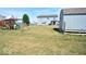 Large backyard with a shed, playground, and fire pit at 833 Palisades Ct, Greenwood, IN 46143