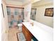 Cozy bathroom with decorative shower curtain and vanity with ample countertop space at 833 Palisades Ct, Greenwood, IN 46143