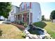 Two-story house with a pond and landscaping in the front yard at 833 Palisades Ct, Greenwood, IN 46143