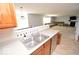 Kitchen with view to the living room, split by a half wall at 833 Palisades Ct, Greenwood, IN 46143