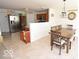 Bright kitchen with a dining area and stainless steel refrigerator at 833 Palisades Ct, Greenwood, IN 46143