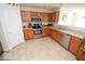 Well-lit kitchen with stainless steel appliances and updated cabinets at 833 Palisades Ct, Greenwood, IN 46143