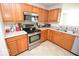 Updated kitchen with stainless steel appliances and light countertops at 833 Palisades Ct, Greenwood, IN 46143