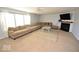 Spacious living room with a cozy fireplace and large window at 833 Palisades Ct, Greenwood, IN 46143