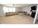 Open-concept living room with a large sectional couch, fireplace, and lots of light at 833 Palisades Ct, Greenwood, IN 46143