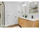 Elegant bathroom with double vanity, modern fixtures, and a frameless shower at 923 E Pleasant Run Pkwy S Dr, Indianapolis, IN 46203