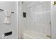 Clean bathroom with marble shower, white walls, and a bathtub at 923 E Pleasant Run Pkwy S Dr, Indianapolis, IN 46203