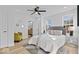 Bright bedroom with a comfortable bed, light walls, and hardwood floors at 923 E Pleasant Run Pkwy S Dr, Indianapolis, IN 46203