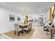 Elegant dining room with a large wooden table and a modern chandelier at 923 E Pleasant Run Pkwy S Dr, Indianapolis, IN 46203