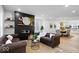 Spacious living room featuring a black shiplap fireplace and comfortable seating at 923 E Pleasant Run Pkwy S Dr, Indianapolis, IN 46203