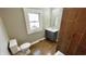 Bathroom with wood-look tile and updated vanity at 929 N Bancroft St, Indianapolis, IN 46201