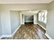 Spacious bedroom with wood flooring, neutral walls and an additional room at 929 N Bancroft St, Indianapolis, IN 46201