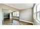 Well-lit bedroom with wood flooring, neutral walls, and large windows at 929 N Bancroft St, Indianapolis, IN 46201
