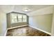 Charming bedroom with wood floors, large windows, and neutral walls at 929 N Bancroft St, Indianapolis, IN 46201