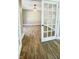 Bright dining room features hardwood floors and a view into another room at 929 N Bancroft St, Indianapolis, IN 46201