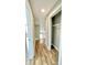 Hallway with hardwood floors and open shelving at 929 N Bancroft St, Indianapolis, IN 46201